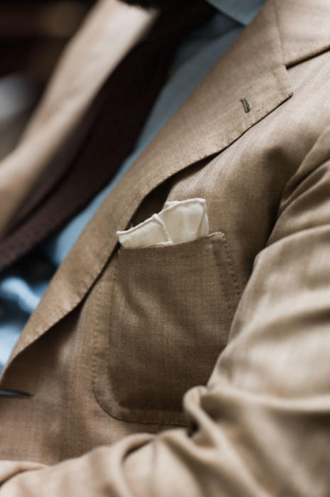 tan Caliendo jacket and cream pocket square