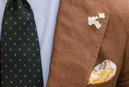 Brown linen suit with cream flower