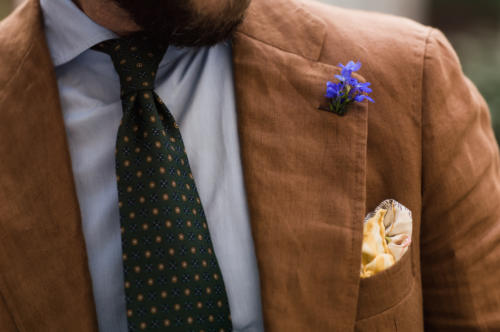 Brown suit with blue flower