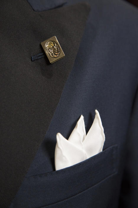 vintage cufflink worn as boutonniere