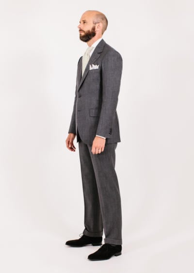 Grey suit, cream tie. Very formal.