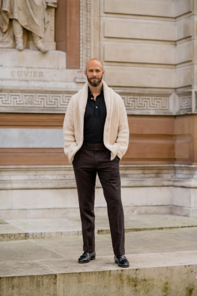 Cream knit, black polo, brown trousers