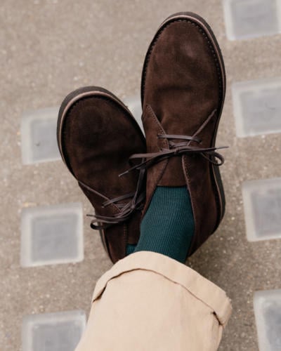 Desert boots with green socks and khaki chinos