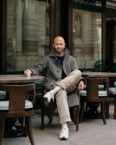 Grey herringbone coat with trainers