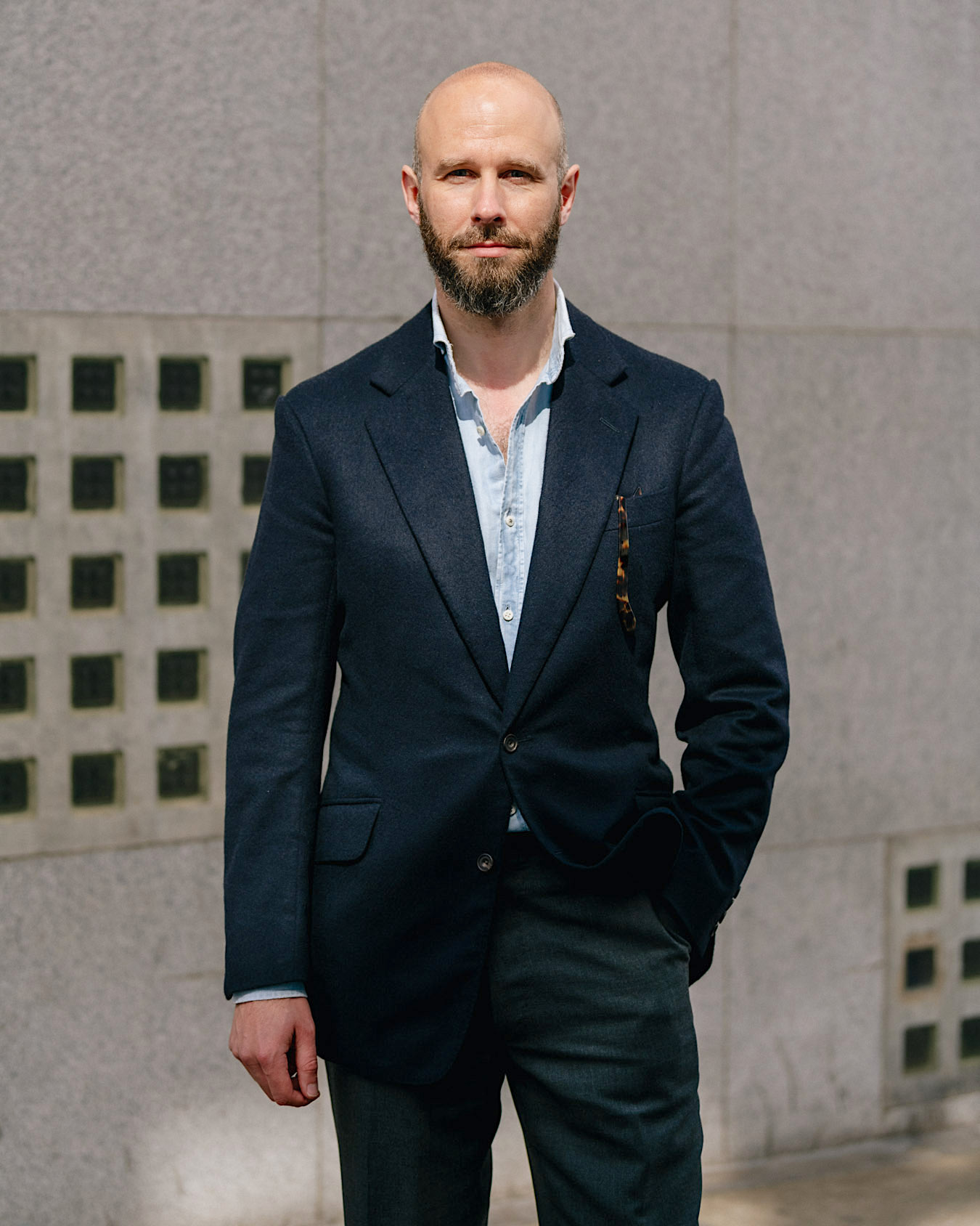 navy blazer and grey trousers 