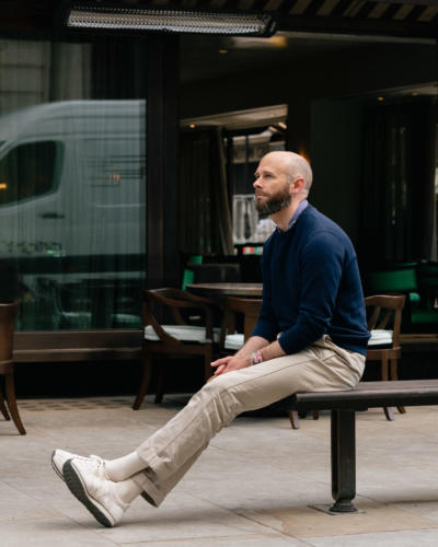 Navy sweatshirt with trainers and chinos