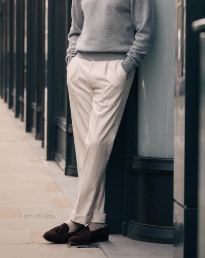 Grey polo with cream trousers