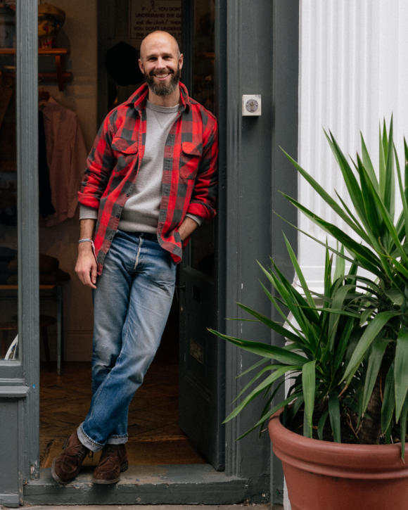 male fan wearing denim jacket customised with mulitiple sew on